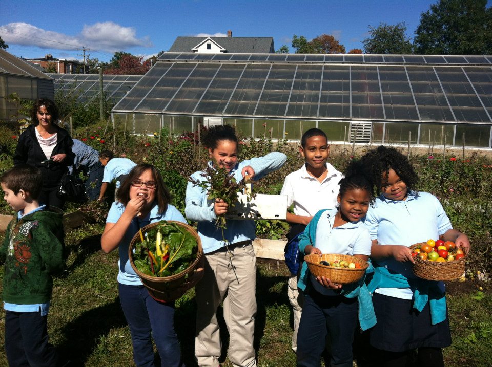 Kids with vegetables at Urban Oaks Farm