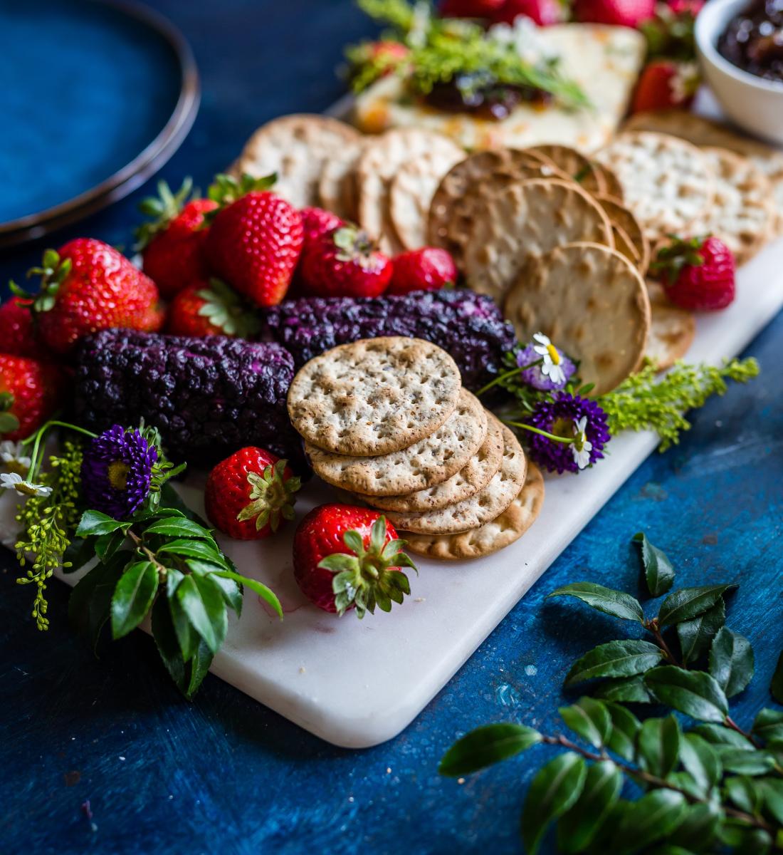 strawberries and crackers platter with flowers